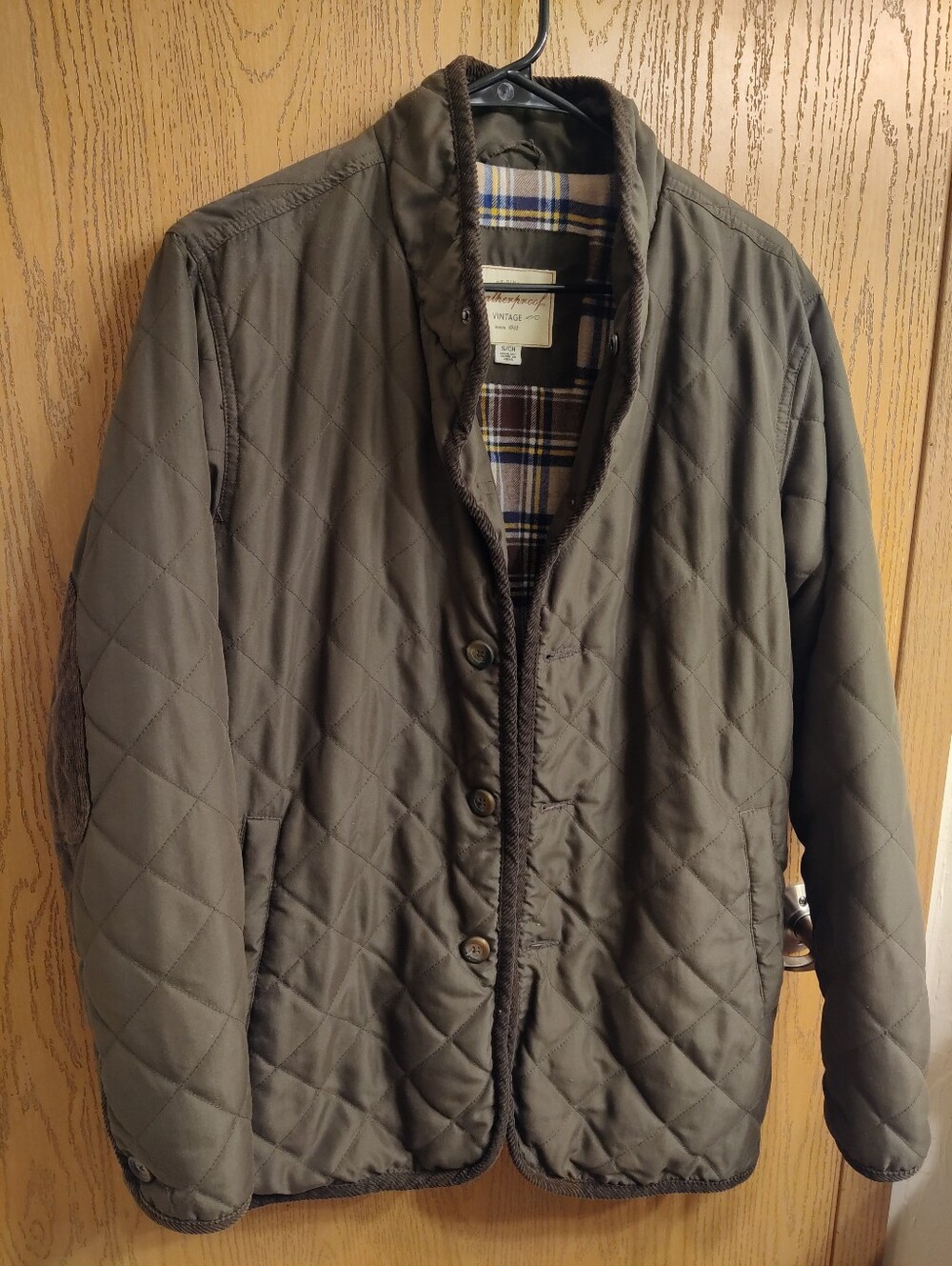 Weatherproof Jacket with Olive Green Shell and Brown Plaid Trim
